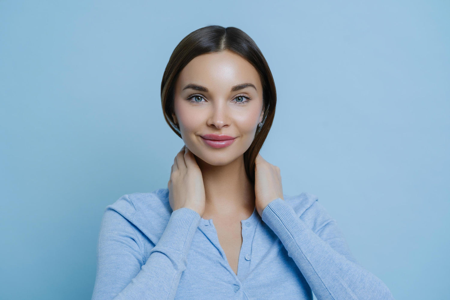 headshot-of-young-lovely-woman-keeps-hands-on-neck-has-european-appearance-happy-to-hear-pleasant-words-wears-casual-sweater-isolated-over-blue-background-human-face-expressions-conce_22b864ce-eae6-43d8-aa5e-187e45a88833 @ Happytoys Sexshop: online sex shop for Feeling Happy & Easy 😊 the erotic store owned by a woman
