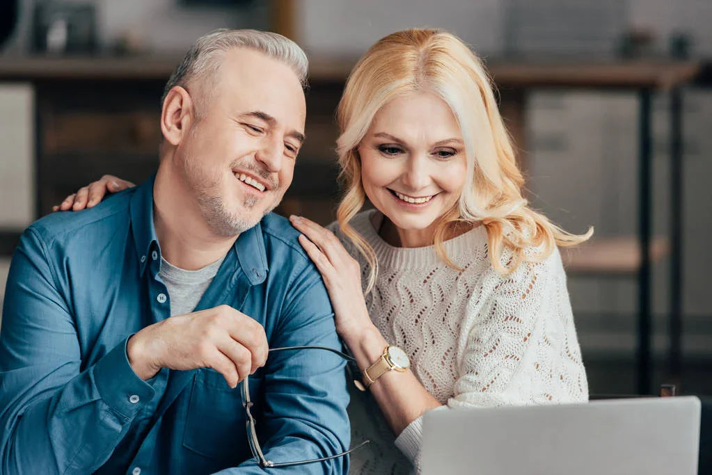 stock-photo-handsome-man-holding-glasses-smiling-attractive-wife-while-looking-laptop_fb386daa-8913-40f6-bb54-54c424a5bdf3 @ Happytoys Sexshop: online sex shop for Feeling Happy & Easy 😊 the erotic store owned by a woman